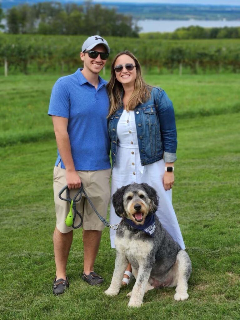 Dr. Leah Peres with her husband Nick and dog Moose
